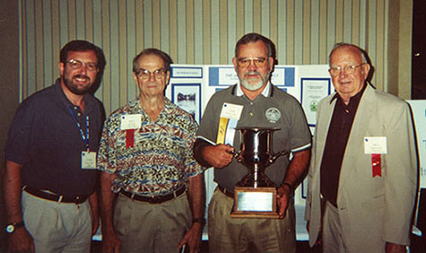 Steve Riley, Ken Heitzke, Tom Peeples, and Bill Mottel with the MASC award