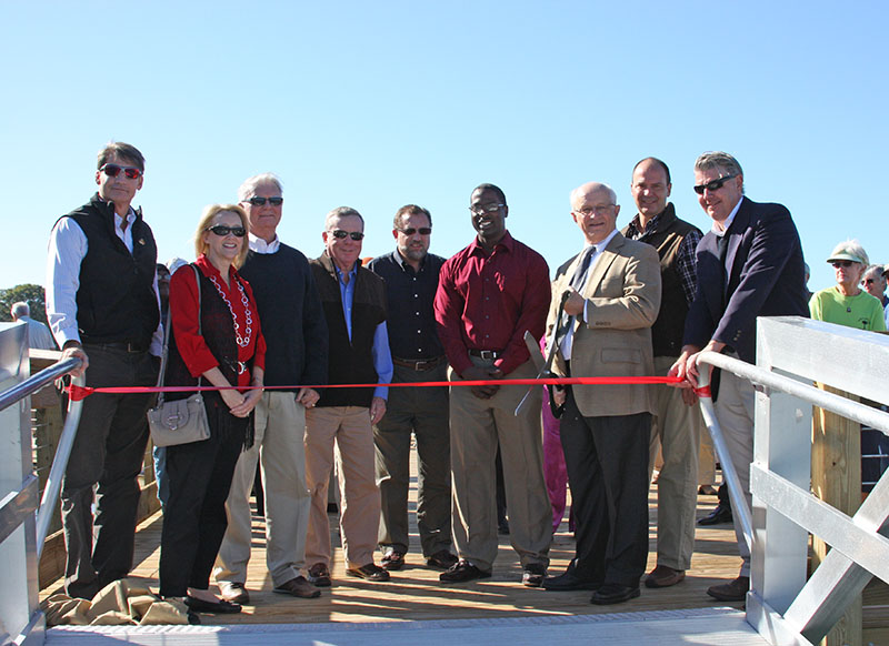 Ribbon cutting ceremony at entrance of floating dock