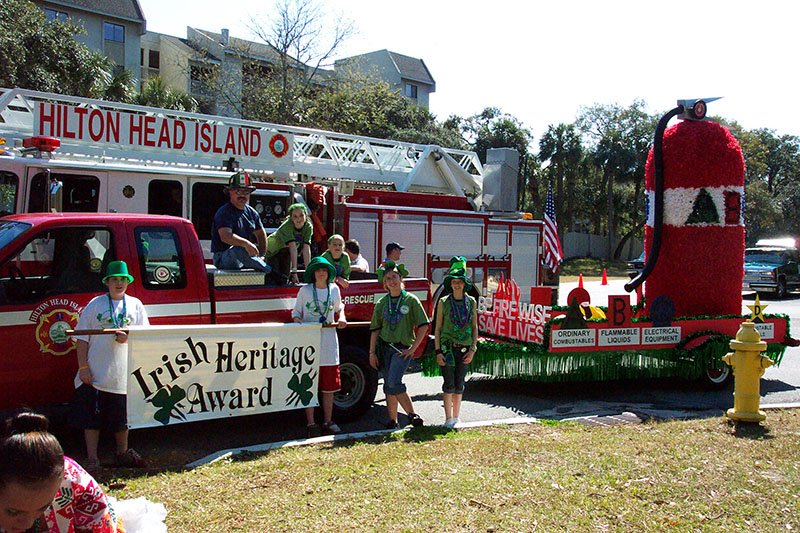 Fire Rescue parade float with kids holding award banner